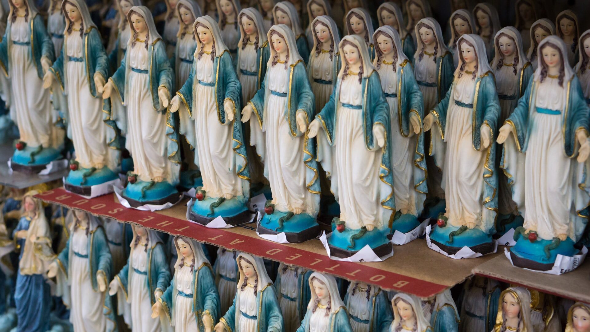 Shelves and shelves of Virgin Mary statuettes.